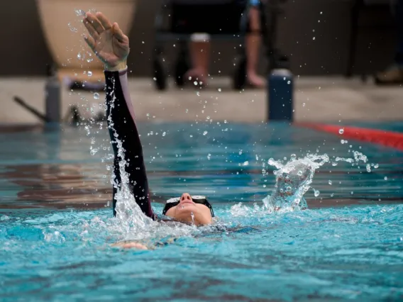 Annalysa Lovos, a member of the University of Arizona Para swim team practices her backstroke at the Student Recreation Center pool.