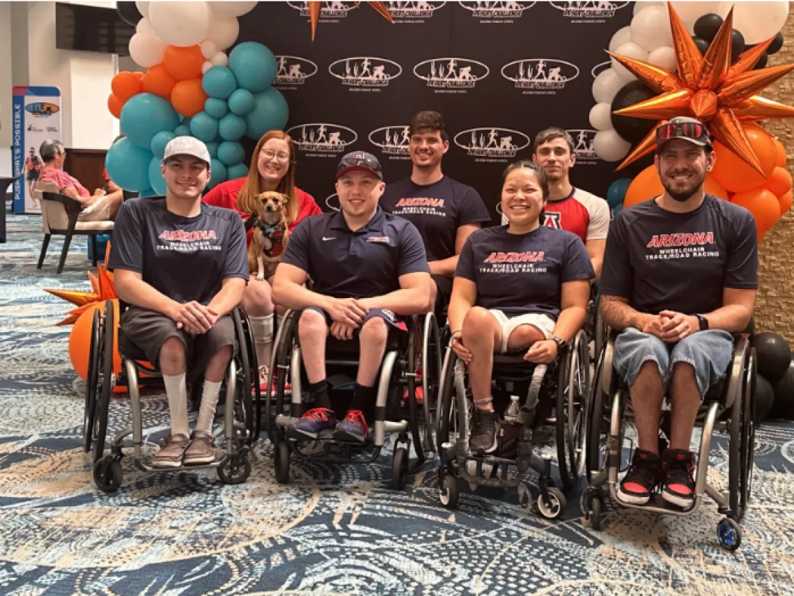 Group Photo of Adaptive Athletics track team. Includes: Dustin Stallberg, Aidan Gravelle, Wyatt Willand, Chelsea Stein, Valera Jacob Allen, Myranda Mishler, Coach Erik Hightower. 